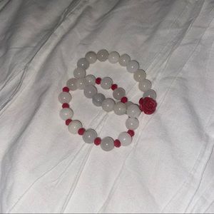 Matching red and white beaded bracelet with rose
